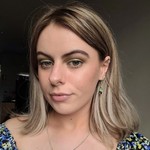 A photo of content executive and position expert Emma Davies. She is smiling and looking directly at the camera.